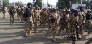 Military police hunters march through Maiduguri in show of solidarity