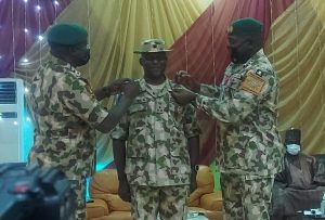 Theatre Commander and Commander Multinational Joint Task Force decorating one of the newly promoted Brigadier Generals at the ceremony in Maiduguri on Tuesday.