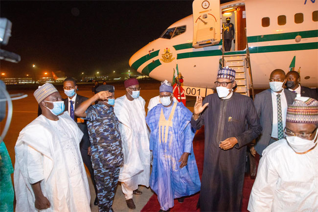 This photo shows President Muhammadu Buhari with others shortly after he returned to the country on March 18 2022.