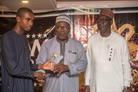 Publisher of SolaceBase Mr. Abdullateed Jos Present Young Innovator Award Engr Mustapha Gajibo who produced electric vehicle in Borno as Dr Kabir Sufi Chir Panel of Juty Watches on