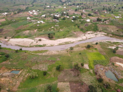 Abandoned mining pits on farmland near a stream in the Sabon Barki area of Plateau State