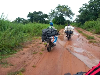 Two smugglers with motorcycle loaded with rice heading back to Nigeria