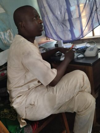 Hamza Umar officer in charge of Magazu PHC at his office